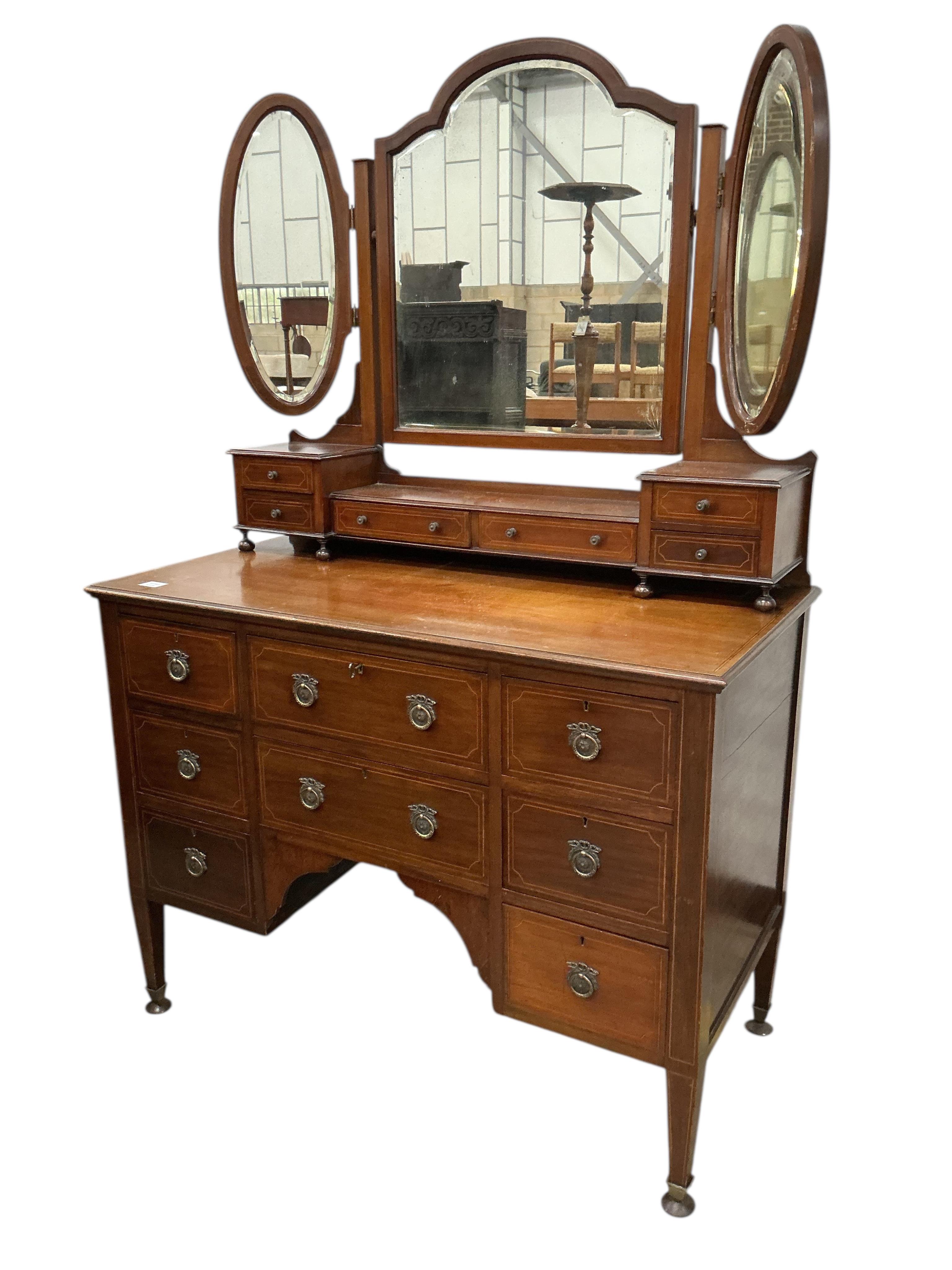 An Edwardian inlaid mahogany dressing table and matching chest of four drawers, larger width 124cm, depth 56cm, height 175cm